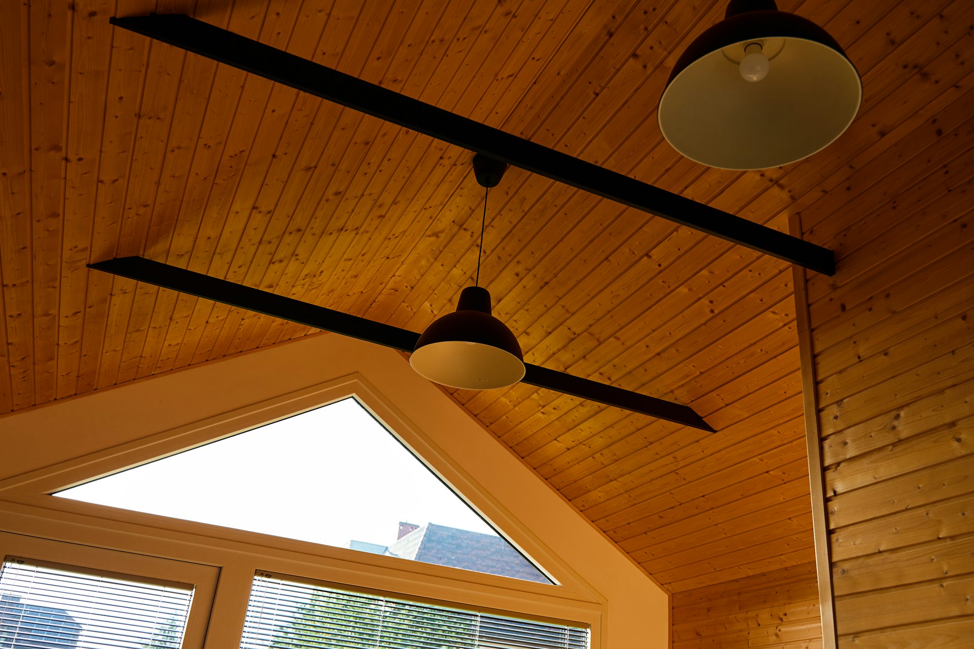 Ceiling in wooden house with lamps
